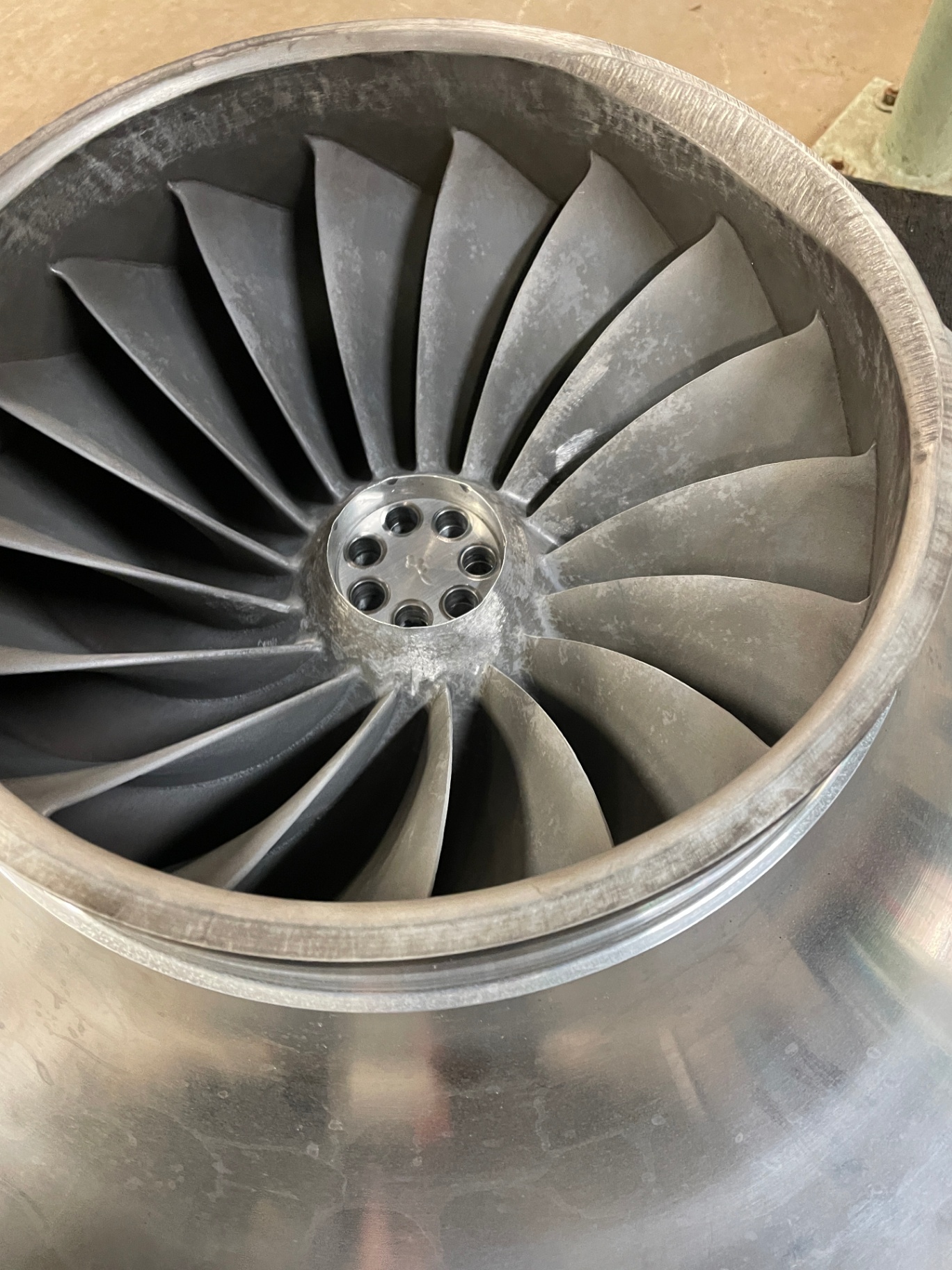 Cleaned centrifugal compressor impeller staged on the shop floor