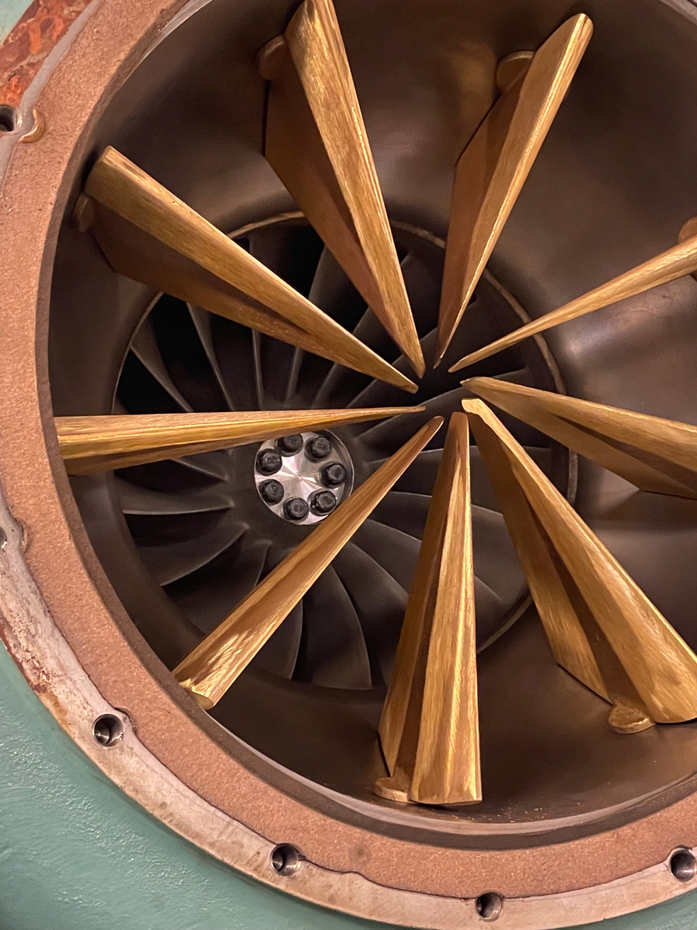 Close-up of inlet guide vanes and impeller wheel inside a chiller compressor